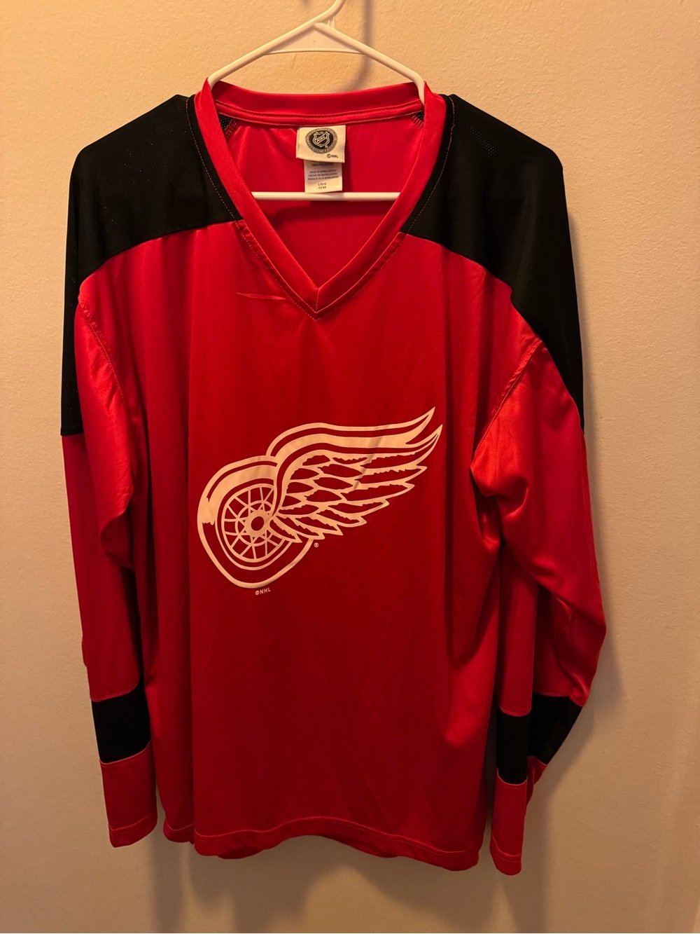 NHL Red and Black Long-Sleeve Hockey Jersey with Winged Wheel Logo